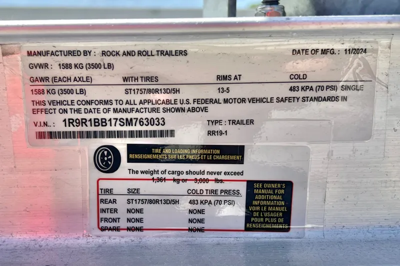 Slide: The Image of Trailer specification label showing weight limits, tire details, and manufacturing information. - 20