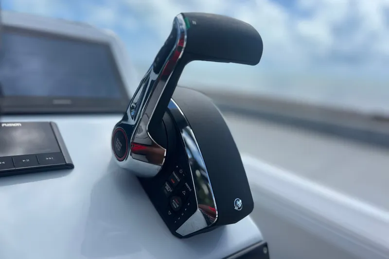 Slide: The Image of Boat throttle control lever on a modern dashboard, Vtech model 18, 2025. - 52