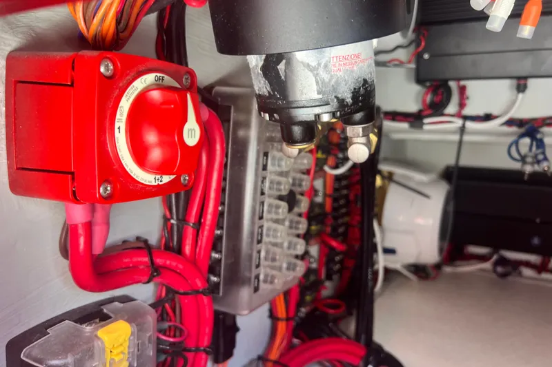 Slide: The Image of Electrical panel with red switch and wiring in Vtech 18, 2025 model. - 75