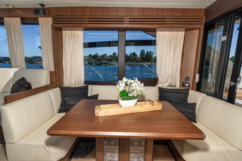 Slide: The Image of Luxurious interior of 2015 Absolute 56 STC yacht with elegant dining area and scenic window view. - 23