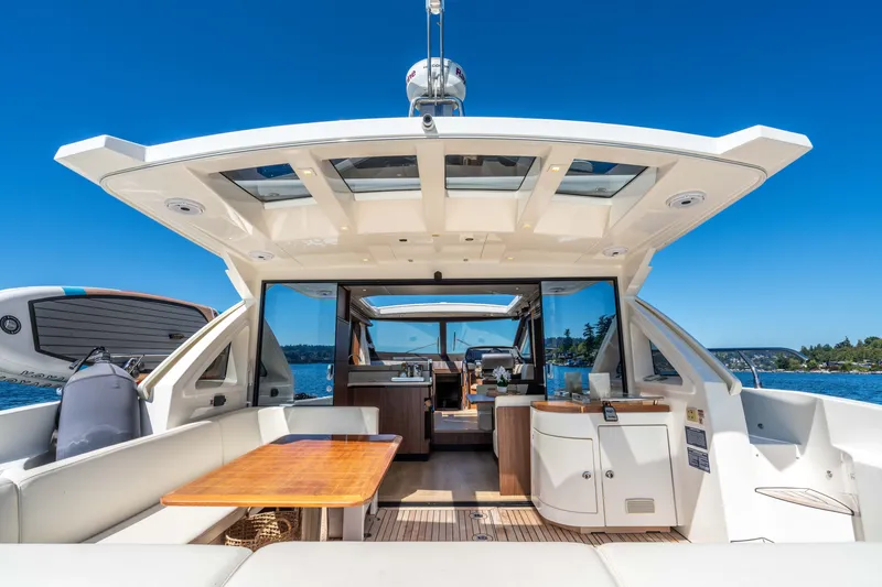 Slide: The Image of Luxurious 2015 Absolute 56 STC yacht interior with open deck and scenic ocean view. - 58