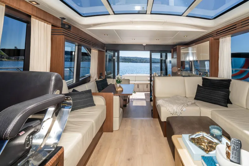 Slide: The Image of Luxurious interior of 2015 Absolute 56 STC yacht with elegant seating and panoramic windows. - 29