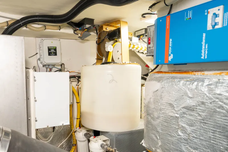 Slide: The Image of Engine room of 2015 Absolute 56 STC yacht with electrical and mechanical components. - 73