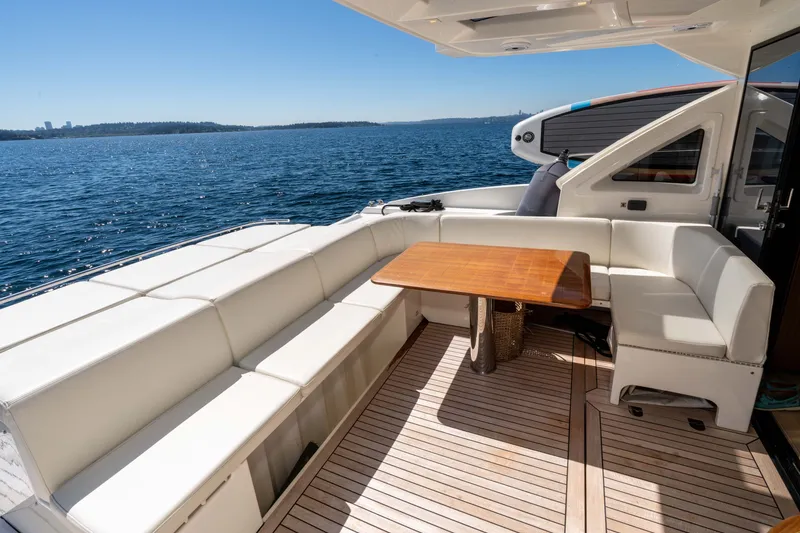 Slide: The Image of Luxurious 2015 Absolute 56 STC yacht deck with elegant seating and ocean view. - 56