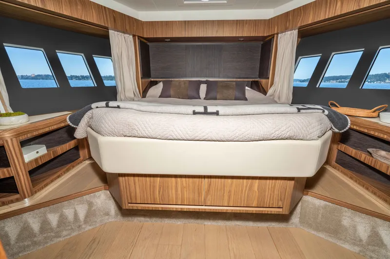 Slide: The Image of Luxurious cabin interior of 2015 Absolute 56 STC yacht with panoramic windows and elegant wood finish. - 49