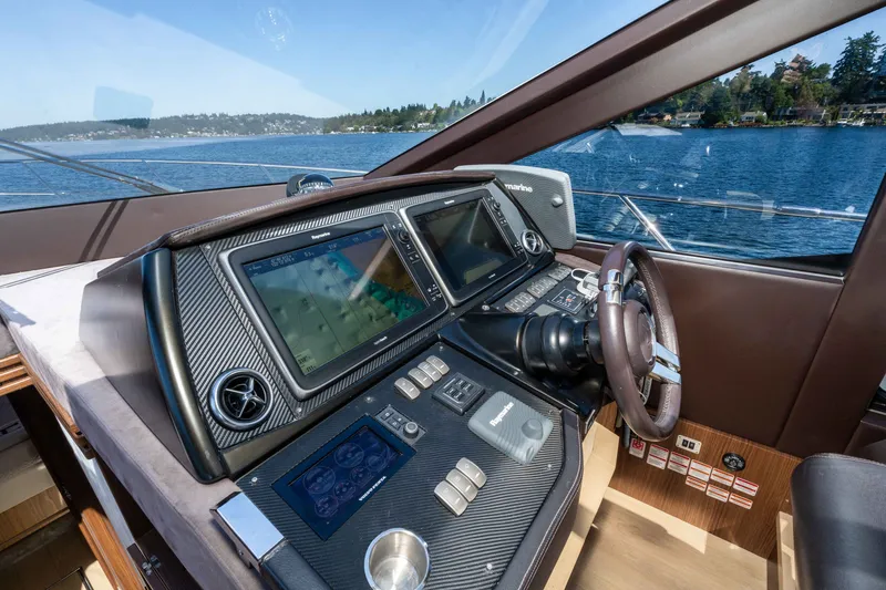 Slide: The Image of Helm of 2015 Absolute 56 STC yacht with advanced navigation systems and scenic water view. - 19