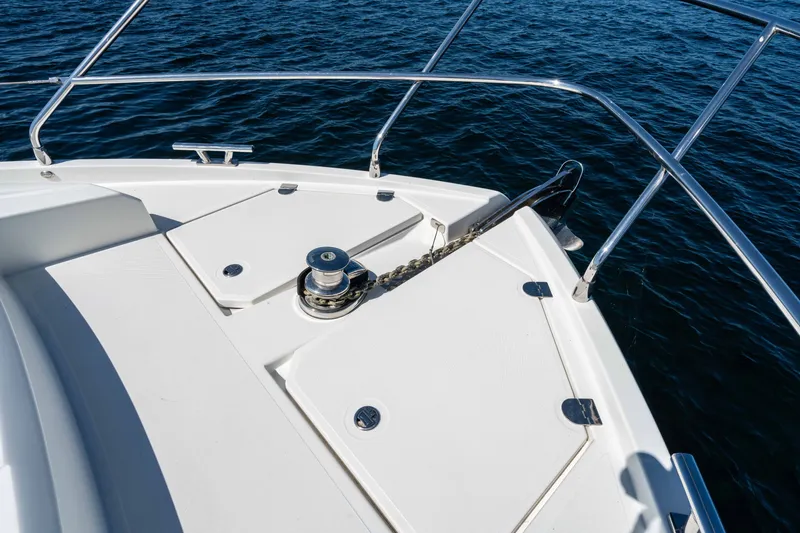Slide: The Image of Bow of 2015 Absolute 56 STC yacht with anchor and railing on open water. - 63