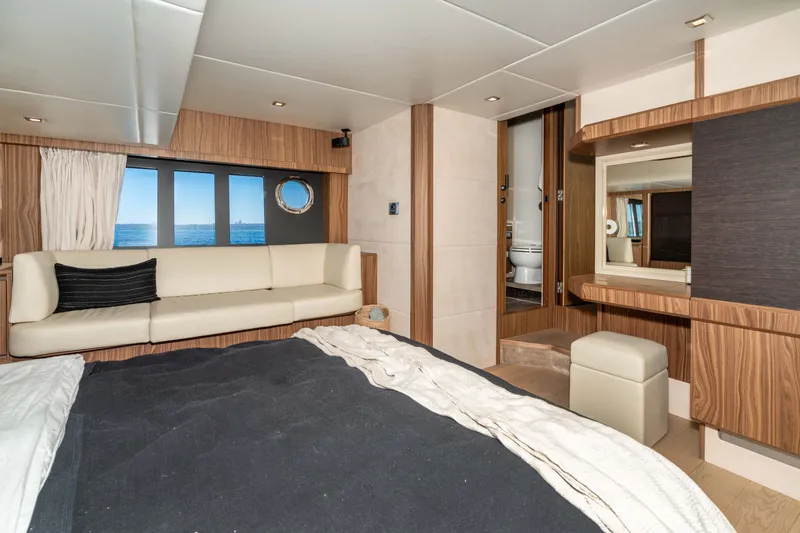 Slide: The Image of Luxurious interior of 2015 Absolute 56 STC yacht with elegant wood finishes and ocean view. - 39