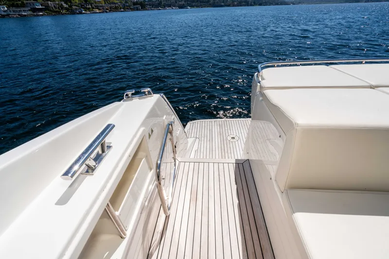 Slide: The Image of Luxury yacht deck of 2015 Absolute 56 STC overlooking serene blue waters. - 57