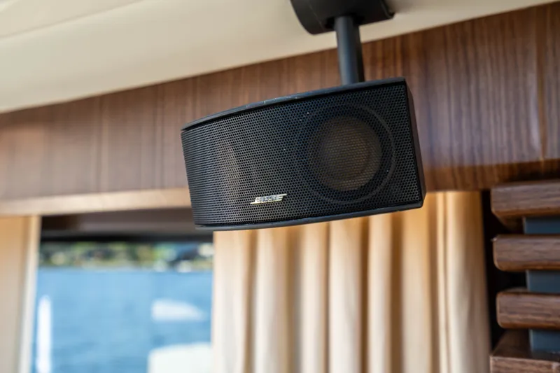 Slide: The Image of Bose speaker mounted inside a 2015 Absolute 56 STC yacht, with wooden interior accents. - 30