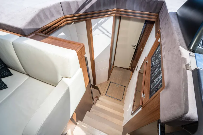 Slide: The Image of Interior view of 2015 Absolute 56 STC yacht, featuring stairs and luxurious seating. - 34