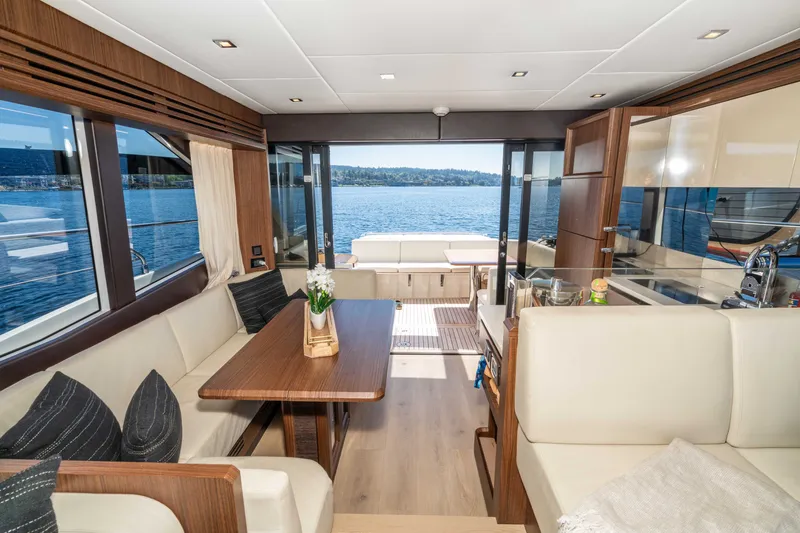 Slide: The Image of Luxurious interior of 2015 Absolute 56 STC yacht with elegant seating and scenic water view. - 27