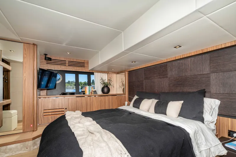 Slide: The Image of Luxurious bedroom interior on 2015 Absolute 56 STC yacht, featuring modern design and cozy bedding. - 36