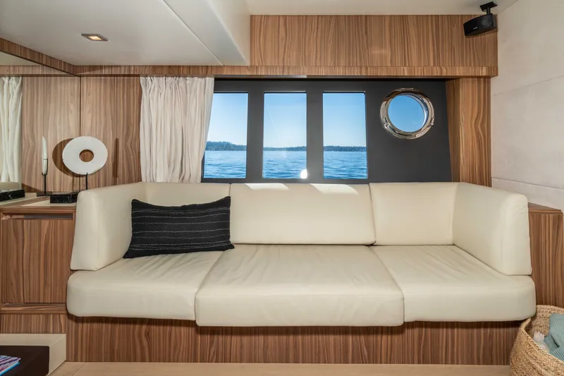 Slide: The Image of Luxurious interior of 2015 Absolute 56 STC yacht with cream sofa and ocean view. - 38