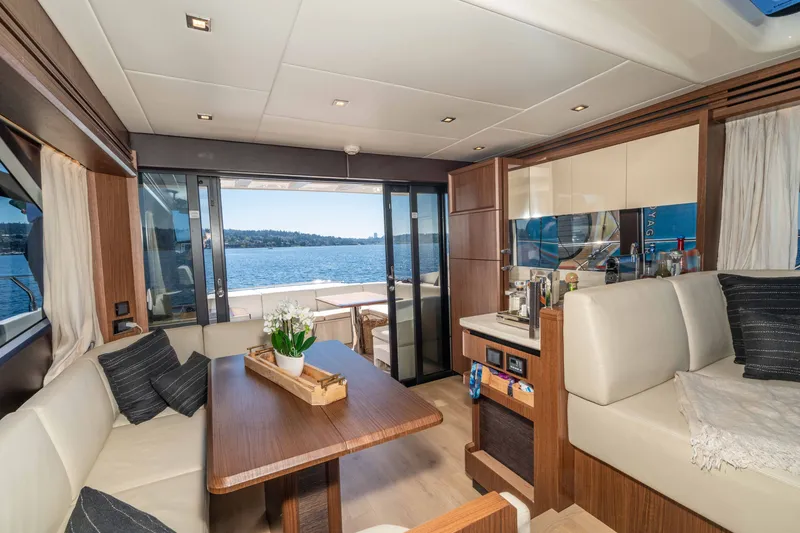 Slide: The Image of Luxurious interior of 2015 Absolute 56 STC yacht with elegant seating and scenic water view. - 28