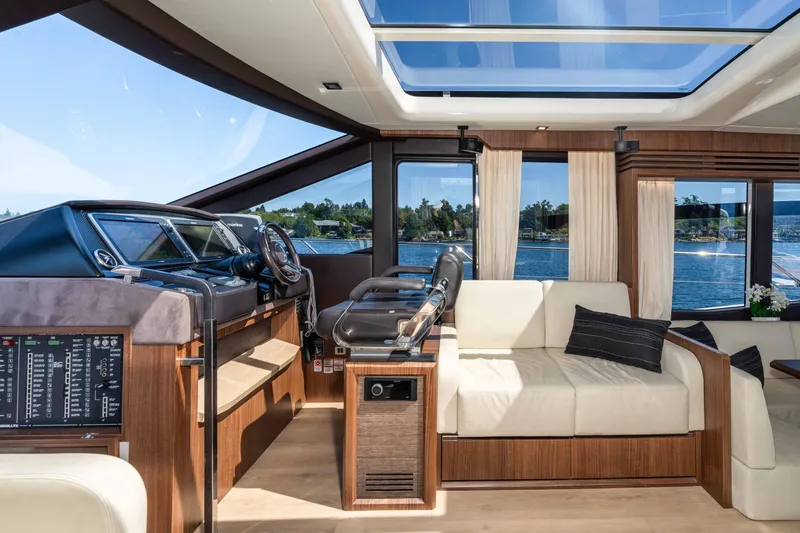 Slide: The Image of Luxurious interior of 2015 Absolute 56 STC yacht with panoramic windows and elegant seating. - 18