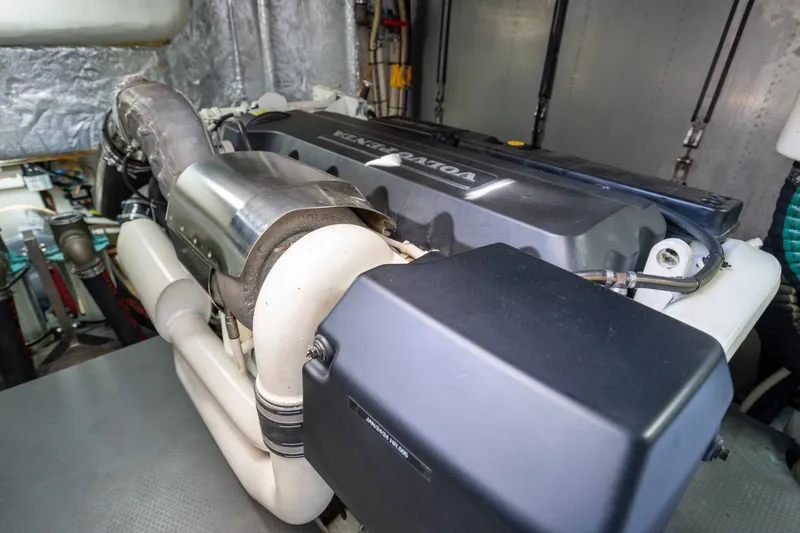 Slide: The Image of Engine room of a 2015 Absolute 56 STC yacht, showcasing detailed machinery components. - 69
