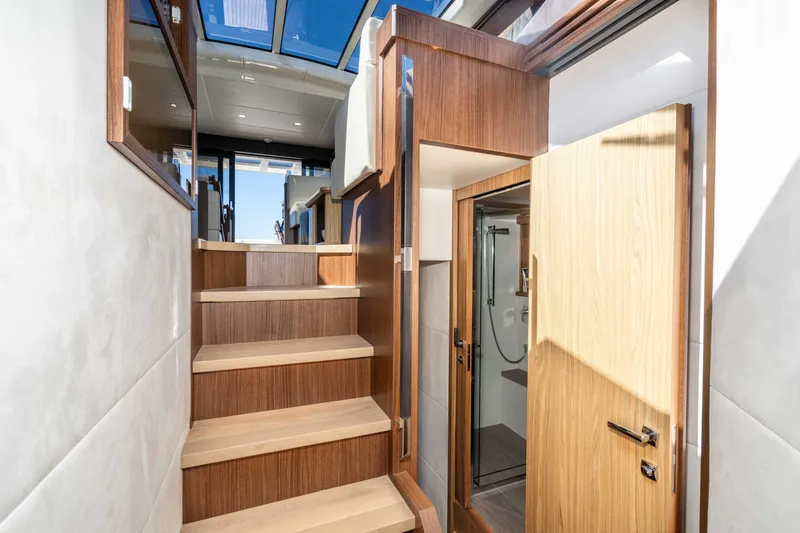 Slide: The Image of Interior of 2015 Absolute 56 STC yacht with wooden stairs and modern design. - 35