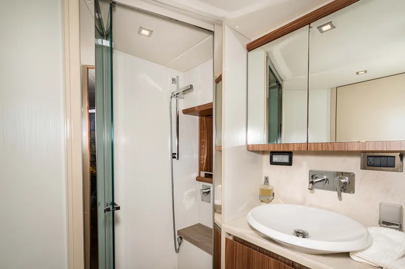 Slide: The Image of Luxurious bathroom in 2015 Absolute 56 STC yacht with modern fixtures and elegant design. - 50