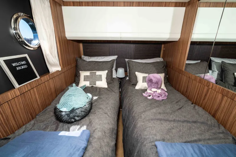 Slide: The Image of Cozy twin cabin in 2015 Absolute 56 STC yacht with plush toys and nautical decor. - 44