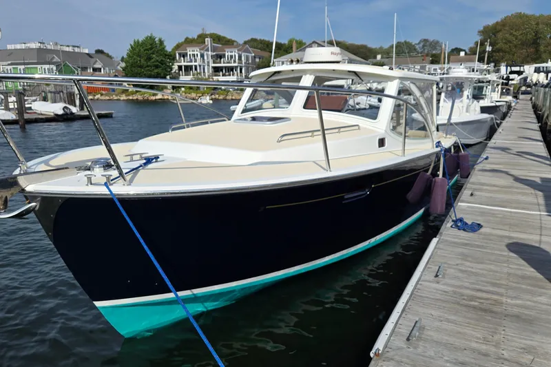 The Image of 2009 MJM 29z Downeast boat with new Yanmar 370 diesel engine docked at marina. - 0