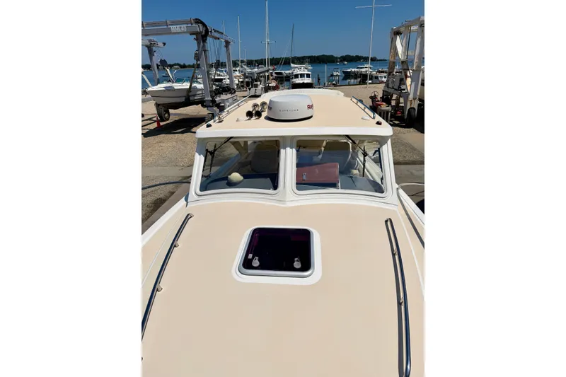 Slide: The Image of 2009 MJM 29z Downeast boat with new Yanmar 370 diesel engine, docked at marina. - 18