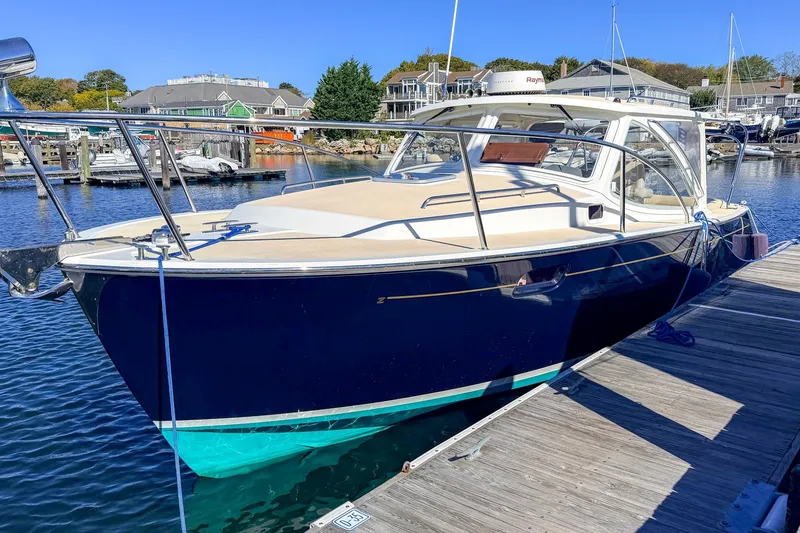 The Image of 2009 MJM 29z Downeast boat with new Yanmar 370 diesel engine docked at marina. - 0