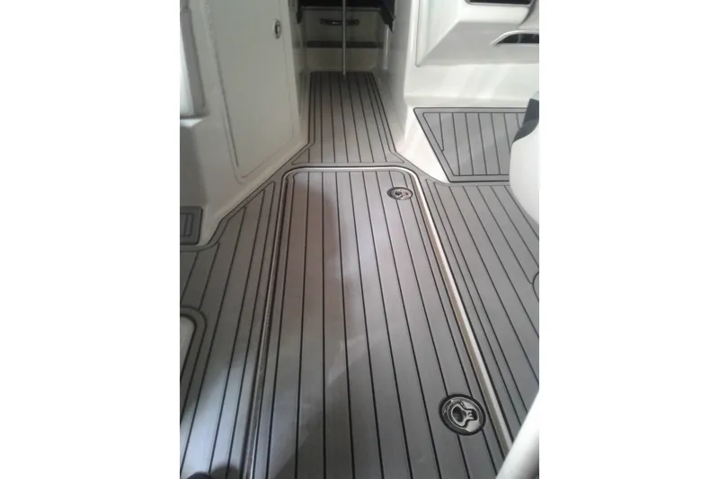 Slide: The Image of Interior view of 2022 Sea Ray SPX 190 Outboard boat with sleek, modern flooring. - 6