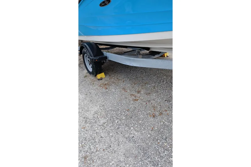 Slide: The Image of 2022 Sea Ray SPX 190 Outboard boat on trailer, parked on gravel. - 5