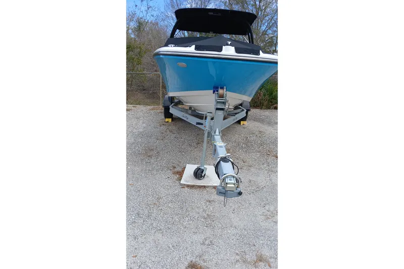 Slide: The Image of 2022 Sea Ray SPX 190 Outboard boat on trailer, parked outdoors. - 1
