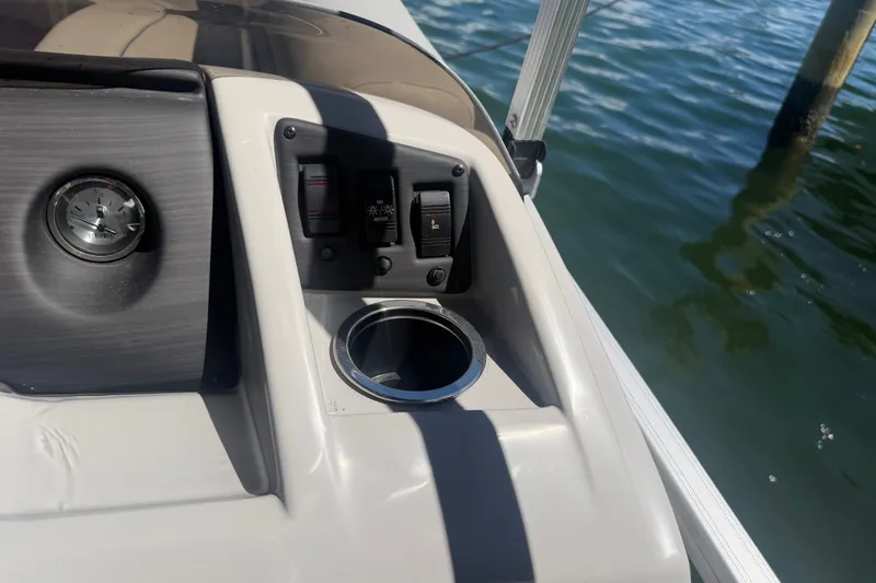 Slide: The Image of Control panel of 2023 Bennington 20 SVL boat with cup holder and switches. - 14