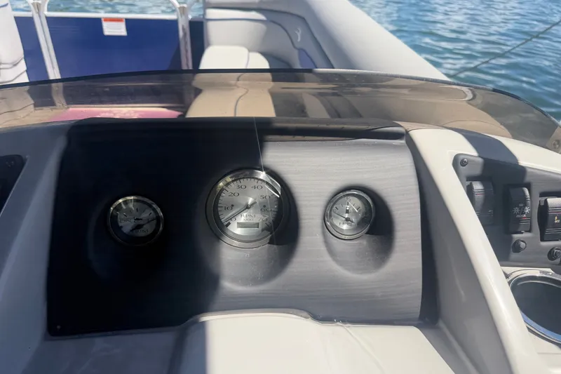 Slide: The Image of Dashboard of a 2023 Bennington 20 SVL boat with gauges and controls. - 11