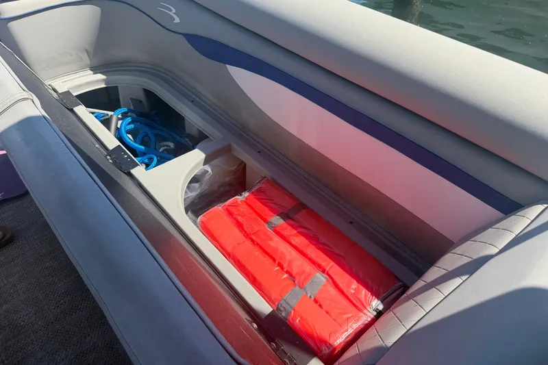 Slide: The Image of Storage compartment in 2023 Bennington 20 SVL boat with life jackets and ropes. - 24