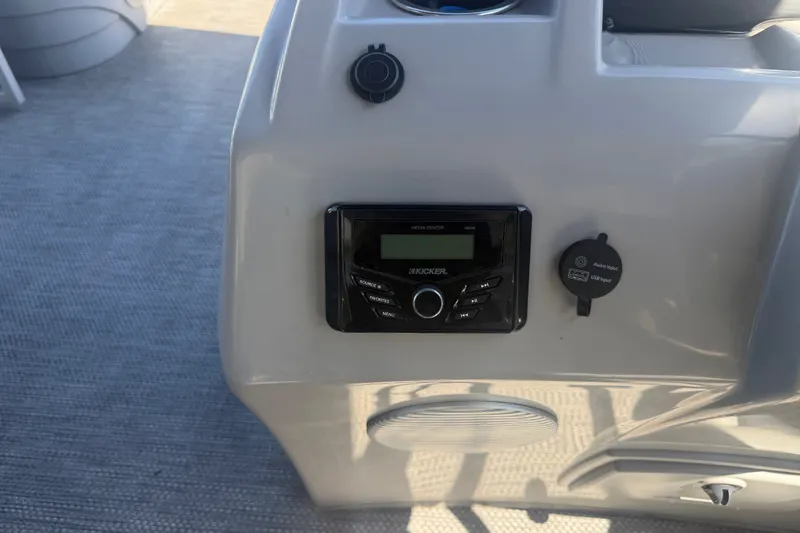 Slide: The Image of 2023 Bennington 20 SVL boat dashboard with Kicker media center and USB input. - 10