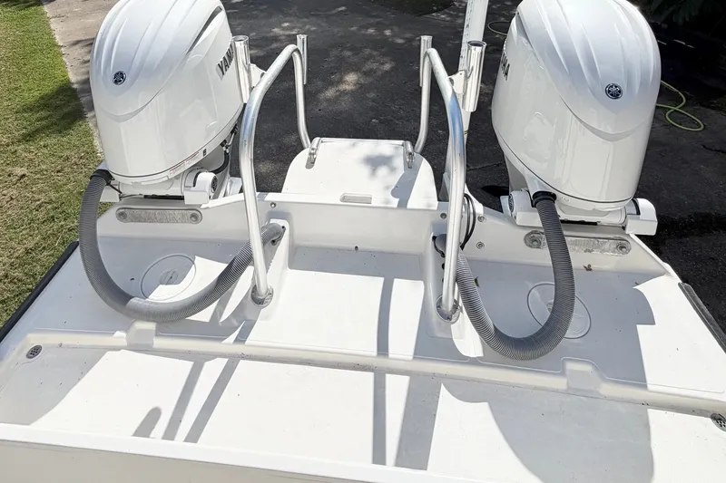 Slide: The Image of Calcutta 263 boat with dual Yamaha outboard motors, 2015 model, on a sunny day. - 14