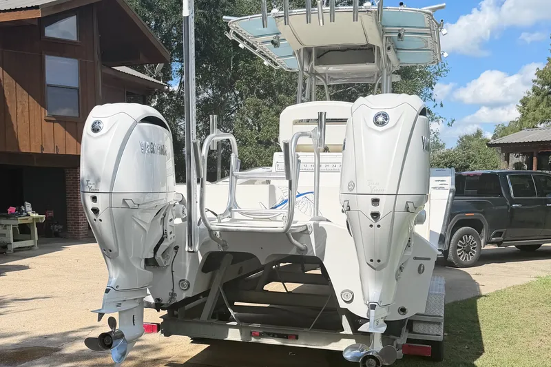 Slide: The Image of 2015 Calcutta 263 boat with dual Yamaha outboard motors on a trailer. - 9