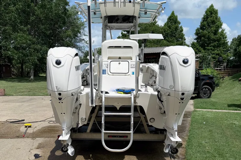 Slide: The Image of Calcutta 263 boat with dual Yamaha engines, parked outdoors, 2015 model. - 5