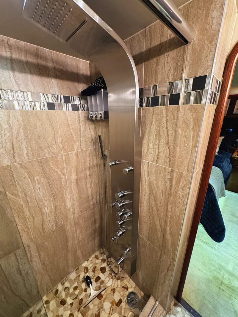 Slide: The Image of Luxurious shower cabin with modern fixtures and stylish tiles in a yacht. - 46