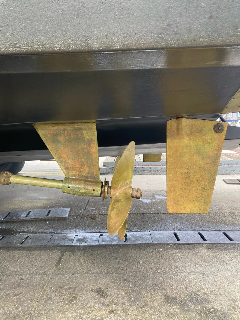 Slide: The Image of Close-up of a propeller and rudder on a 1990 Viking 55 Motor Yacht. - 13