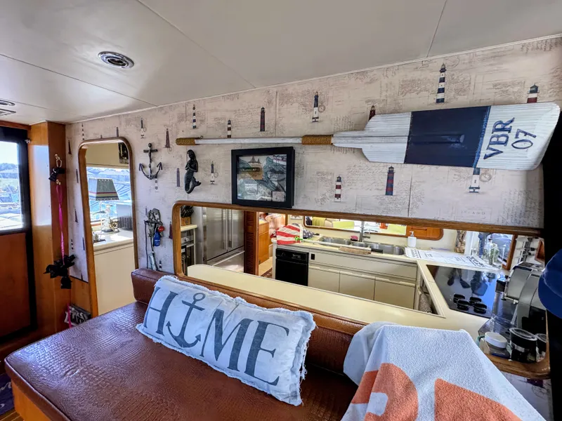 Slide: The Image of Interior of a yacht with nautical decor, including a paddle and a 'Home' pillow. - 26
