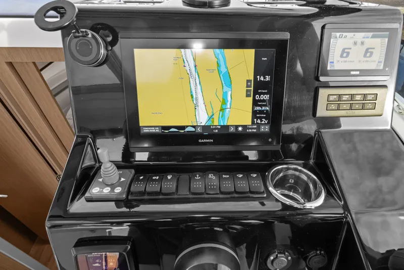 Slide: The Image of Control panel of 2025 Jeanneau NC 895 Series 2 with navigation display. - 33