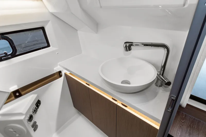 Slide: The Image of Modern bathroom interior of 2025 Jeanneau NC 895 Series 2 boat, featuring sleek sink and faucet. - 22