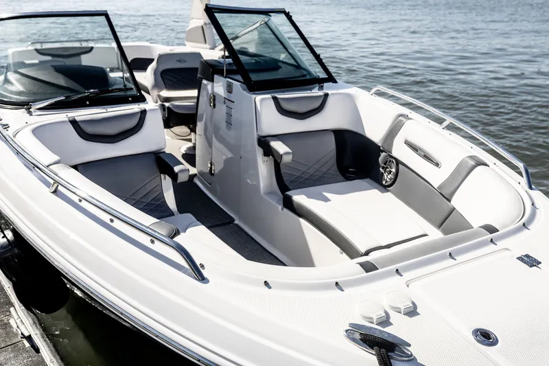 Slide: The Image of 2021 Chaparral 307 SSX boat interior with sleek seating and modern design on the water. - 29