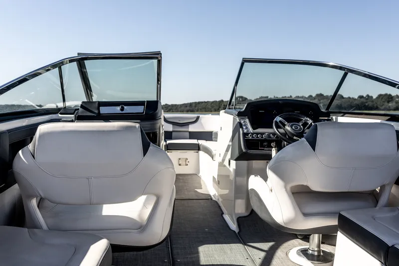 Slide: The Image of Interior of 2021 Chaparral 307 SSX boat with modern seating and dashboard. - 19