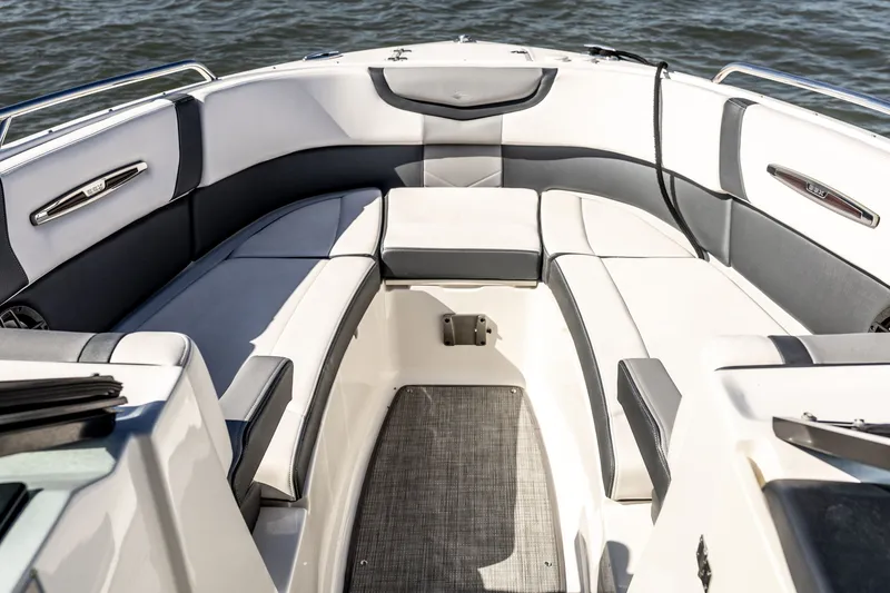 Slide: The Image of Luxurious seating area on a 2021 Chaparral 307 SSX boat, with elegant upholstery. - 31