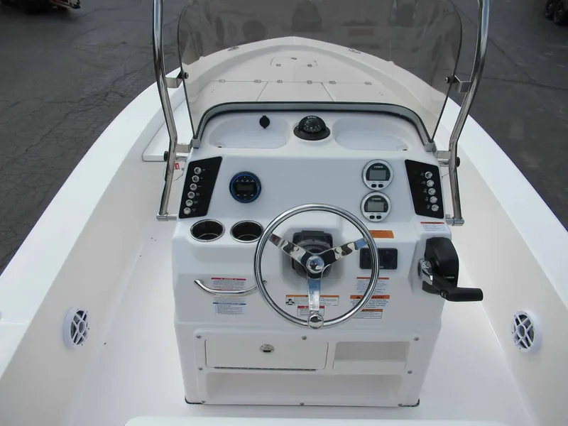 Slide: The Image of The image shows the helm of a Robalo 206 Pro boat with steering wheel and instruments. - 8