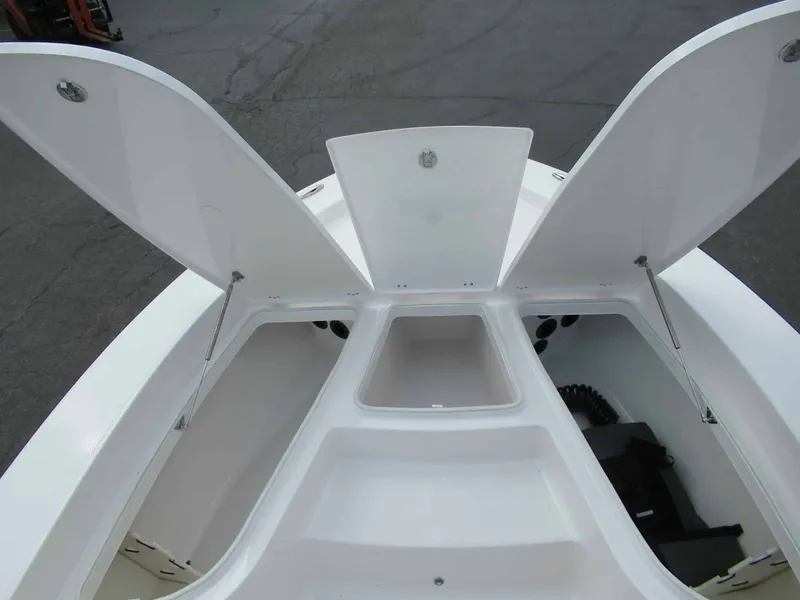 Slide: The Image of The image shows the bow of a Robalo 206 Pro with open storage compartments. - 10