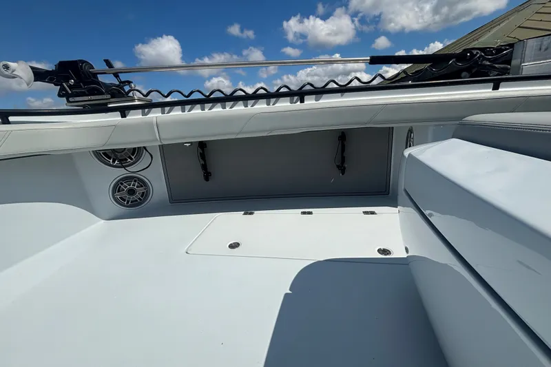 Slide: The Image of 2023 Barker Boatworks 40 HPC deck with speakers and storage, under a clear blue sky. - 19