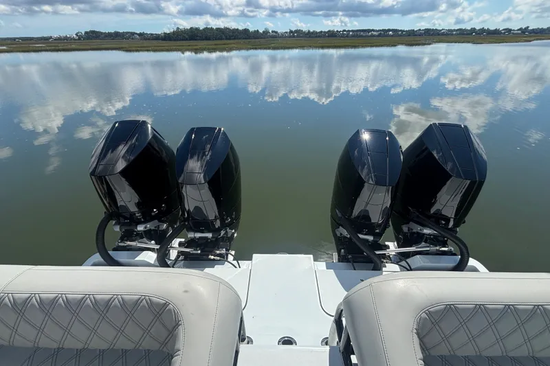Slide: The Image of 2023 Barker Boatworks 40 HPC with four powerful outboard motors on calm water. - 25