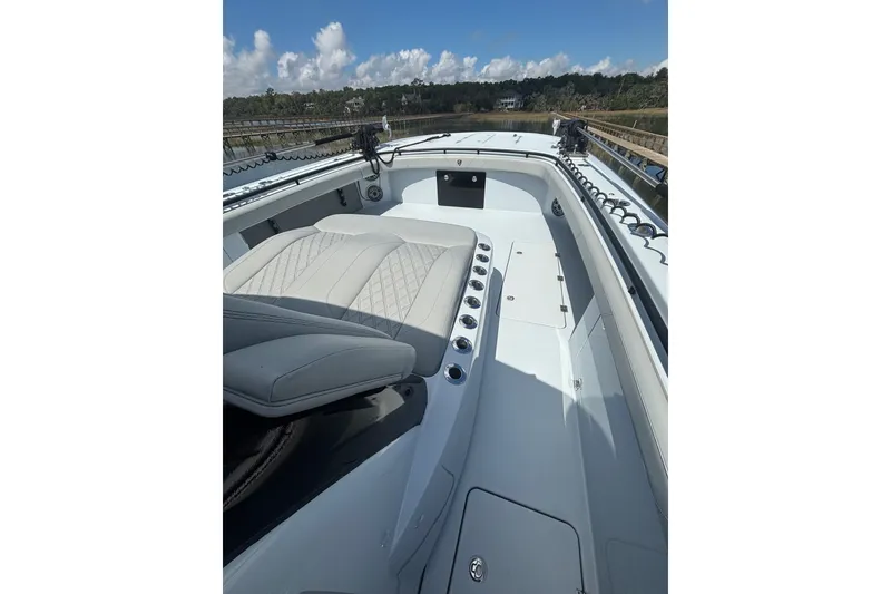 Slide: The Image of 2023 Barker Boatworks 40 HPC interior with sleek seating and modern design. - 11